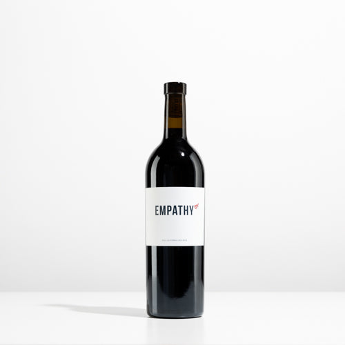 A bottle of 2021 EMPATHY RED on a light gray background