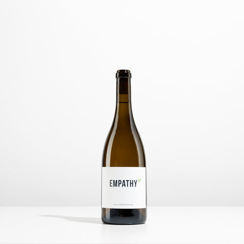 A bottle of 2021 EMPATHY WHITE on a light gray background