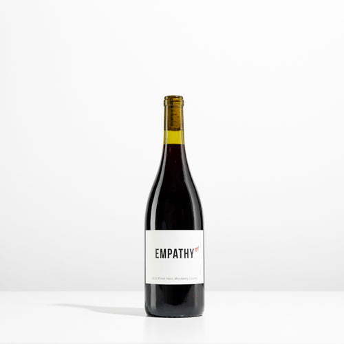 A bottle of 2022 EMPATHY PINOT NOIR MONTEREY COUNTY on a light gray background