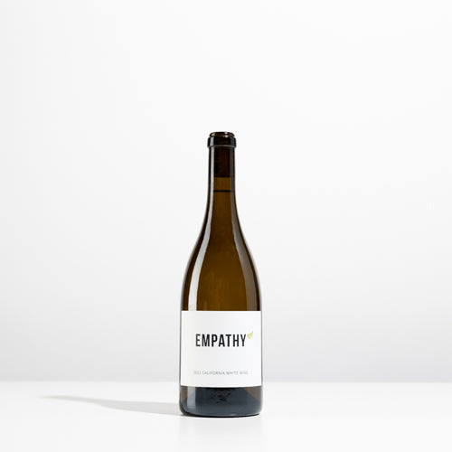 A bottle of 2022 EMPATHY WHITE on a light gray background
