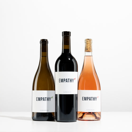 A bottle of EMPATHY COLLECTION on a light gray background