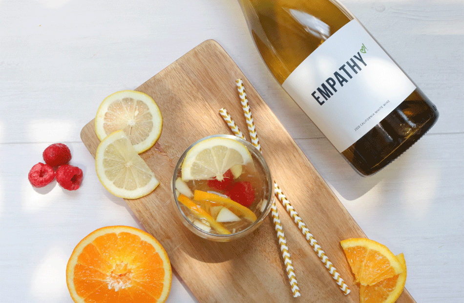 Empathy white wine being used in a sangria recipe with oranges and raspberry's