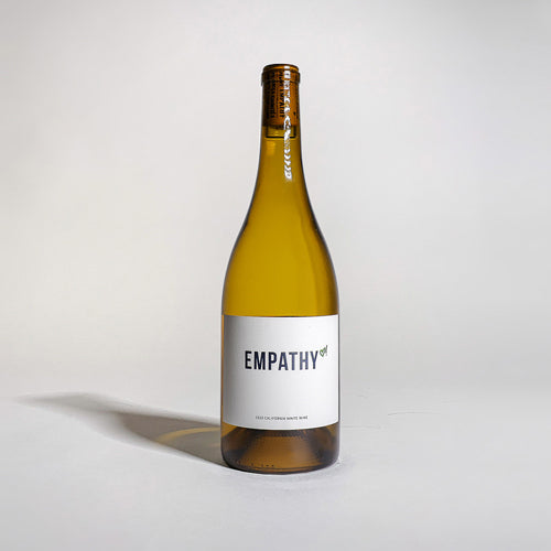 A bottle of 2020 EMPATHY WHITE on a light gray background