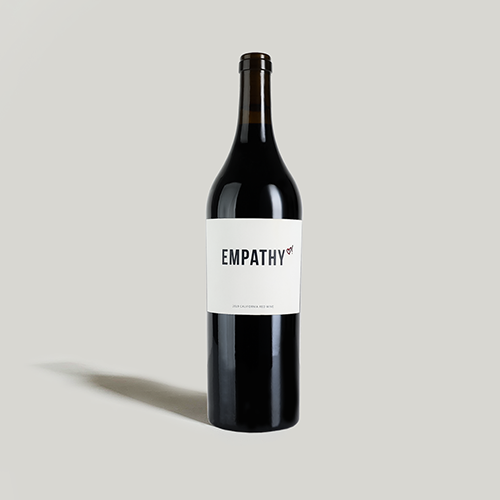 A bottle of 2019 EMPATHY RED on a light gray background