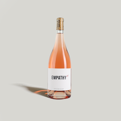 A bottle of 2020 EMPATHY ROSÉ on a light gray background